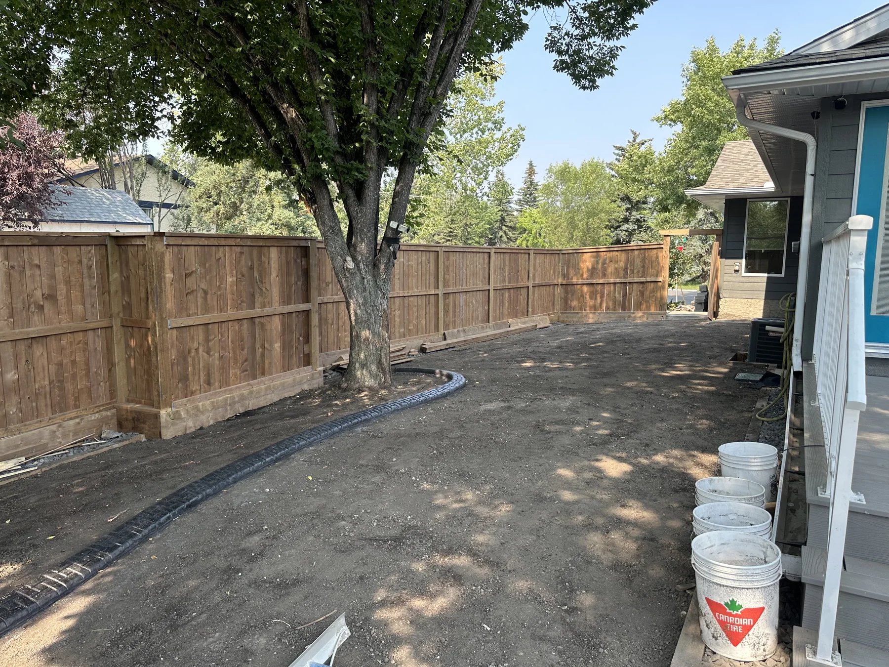 Backyard after site preparation and before sod installation